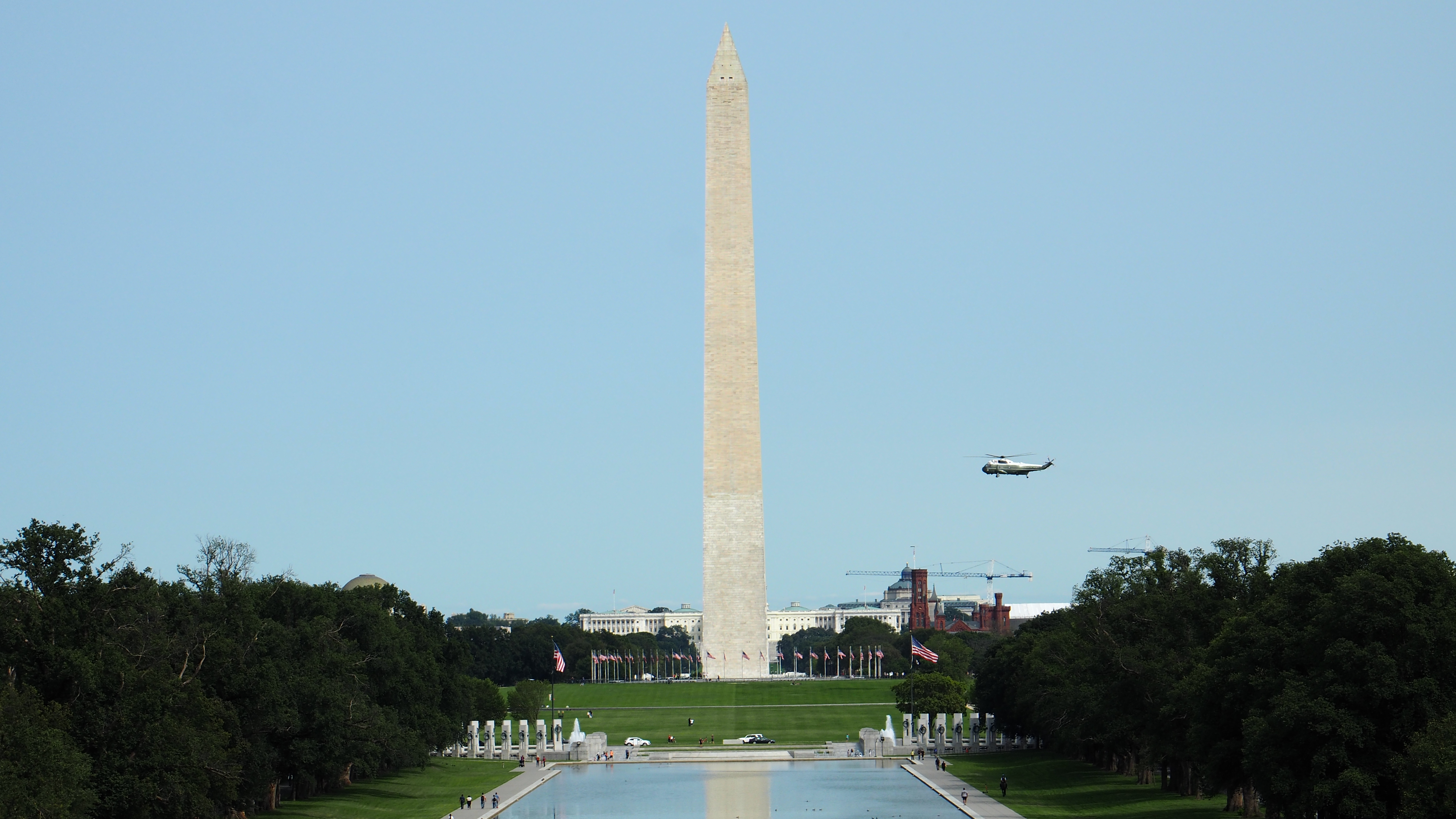 Marine One crossing in front of the Washington Monument.