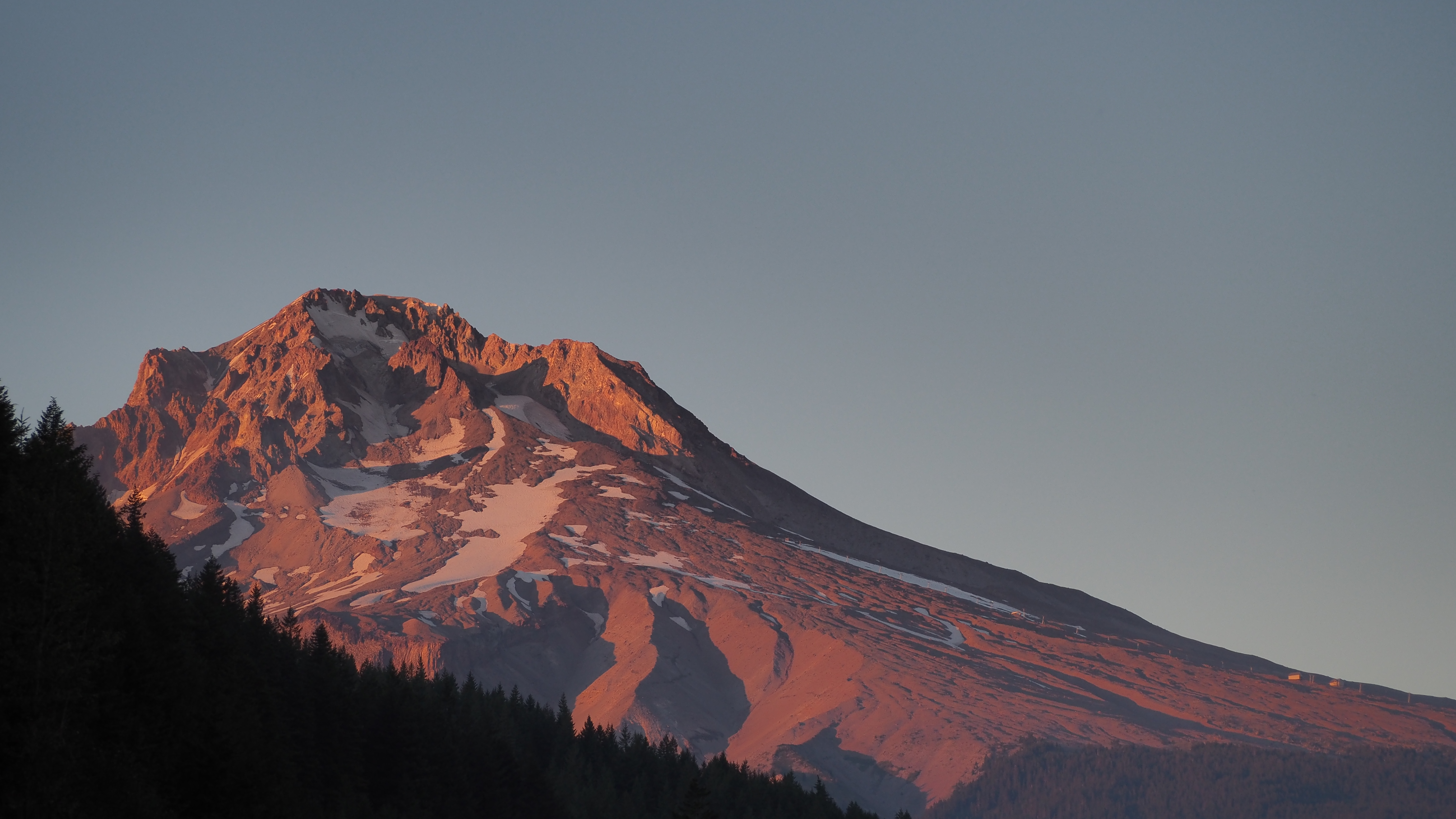 Mount Hood's summit illuminated by alpine glow.
